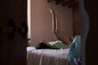© Lucas Ottone/Stocksy - Woman alone in her room