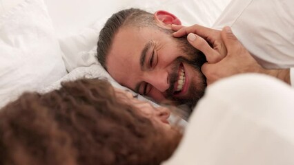 Poster - Happy couple, bedroom fun and morning bonding while lying in bed touching, laughing and face to face expressing love. Funny, romantic and commitment between man and woman in a healthy relationship