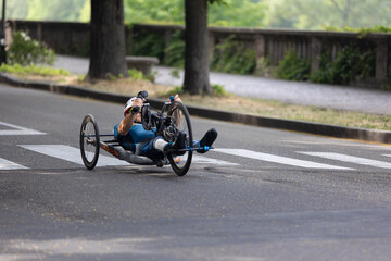 Wall Mural - Athlete with its Special Bike on a City Track during a Race