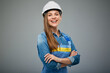 Woman architect or engineer in safety industrial helmet standing with arms crossed. Isolated female portrait.