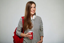 Smiling Student Woman In Striped Shirt With Red Backpack Holding Coffee Cup Looking Away. Isolated Female Portrait On White Background.