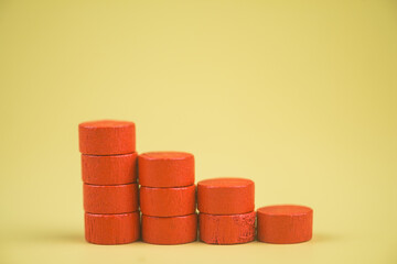 Wall Mural - Bar graph made of red building blocks. Business concept. Red wood cube blocks like bar graph symbolizing sales growth.