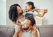 © David L/peopleimages.com - Black family or mother, father and child on sofa together for happiness, love and care. Happy group of people parents or mom, dad and girl kid on living room couch for home growth development