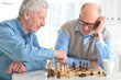 © aletia2011 - Elderly people play a game of chess together