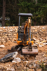 Crawler excavator standing with stone around