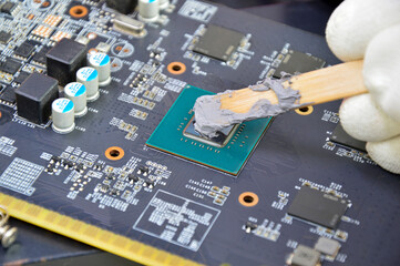 Poster - The image of a technician filling a silicon cooling chip CPU.