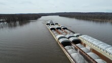 A Towboat Pushes Barges North On The Mississippi River.