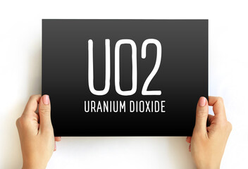 Poster - UO2 - uranium dioxide acronym text on card, abbreviation concept background