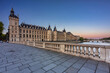 Leinwandbild Motiv The Conciergerie palace and prison by the Seine river at dawn, Paris. France