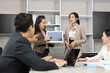 © feeling lucky - Collaborative process of professional businesspeople going over on new project, using paperwork and computer presentation with brainstorming ideas, coworker and work together at office meeting concept