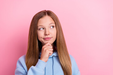 Poster - Closeup photo of young funny curious cute little lady long hair dreamy touch chin look interested empty space offer isolated on pink color background