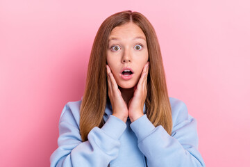 Wall Mural - Closeup photo of young funny face cute girl brown hair touch cheekbones open mouth scared watching you isolated on bright pink color background