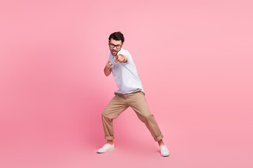 Wall Mural - Full length portrait of young successful guy pointing fingers you camera invite meeting date isolated on pink color background