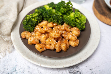 Wall Mural - Shrimp and broccoli, low calorie high protein dish. Sesame seeds in teriyaki sauce. EASY SHRIMP AND BROCCOLI STIR FRY.