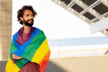 Wall Mural - Happy man with a pride flag. LGBT community.