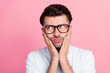 Closeup photo of young handsome unhappy grimace bored touch face glasses stressed have work problems manager look empty space isolated on pink color background