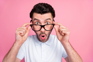 Wall Mural - Closeup photo of young handsome shocked funny excited guy wear glasses pouted lips hold spectacles reaction look you isolated on pink color background