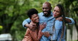 © Marco - Three Friends hugging each other. African man and women embrace smiling