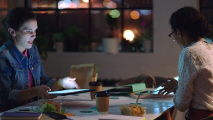 Poster - Planning night, business tablet and women talking about creative advertising strategy, working on web design and website for company. Employees in collaboration on marketing project in dark office
