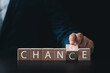 © Thapana_Studio - Business ideas and professional growth, businessman's hands turn wooden cubes from CHANGE to CHANCE, strategic thinking and ways to turn crisis into competitive opportunity for business.