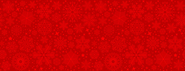 Wall Mural - christmas illustration with various small snowflakes on gradient background in red colors