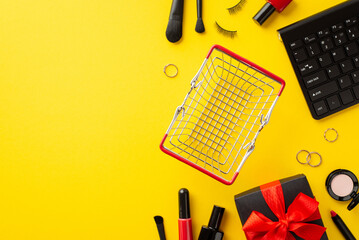 Wall Mural - Cyber monday concept. Top view photo of keyboard empty shopping cart giftbox with bow cosmetics nail polish false eyelashes eyeshadow lip gloss brushes and gold rings on isolated yellow background