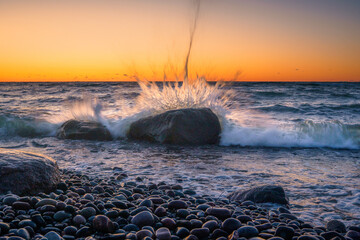 Wall Mural - sea storm with splash from waves on rocky shore