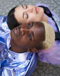 © Leire Cavia/Stocksy - Futuristic portrait of a mixed race fashion couple