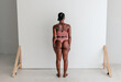 © Erin Brant/Stocksy - Athletic black woman wearing bra and thong