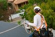 © ByLorena/Stocksy - Woman roofing with protective equipment