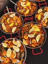 Dishes Of Paella Sit On The Table