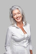 © Trinette Reed/Stocksy - Portrait of mature confident woman laughing