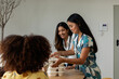 © Valentina Barreto/Stocksy - Women during lunch time at office