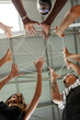 © Valentina Barreto/Stocksy - Crop coworkers joining hands with thread
