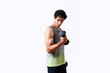 © ALTO IMAGES/Stocksy - Hispanic man doing bicep curl exercise with dumbbell