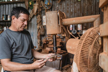 Man Working In A Handicraft Workshop. 