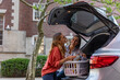 © Raymond Forbes LLC/Stocksy - Mother and Daughter laugh together as she moves into college doorm