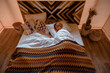 © Milles Studio/Stocksy - Woman sleeping on bed in cozy room