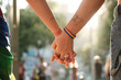 © Malquerida Studio/Stocksy - Anonymous lesbian couple holding hands at pride