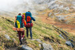 © Manu Prats/Stocksy - Friends hiking on mountain trail