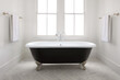 © Trinette Reed/Stocksy - Modern design interior farmhouse bathroom with clawfoot bathtub