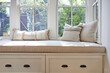 © Trinette Reed/Stocksy - Close-up window seat in modern design farmhouse home