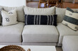 © Trinette Reed/Stocksy - Modern design throw pillows on modern sofa in farmhouse