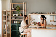 © Malquerida Studio/Stocksy - Couple having coffee in the kitchen