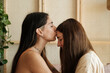 © Malquerida Studio/Stocksy - Woman kissing her girlfriend on head