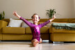 © Eloisa Ramos/Stocksy - little girl practicing artistic gymnastics at home