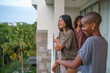 © Jovo Jovanovic/Stocksy - Small group of friends spending happy time together on balcony