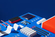 © AUDSHULE/Stocksy - office items on blue set up