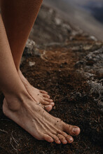 Close Up Photo Of Woman's Feet On The Ground