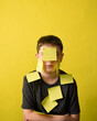 © Angela Waye/Stocksy - Student Wearing Blank Post It Notes